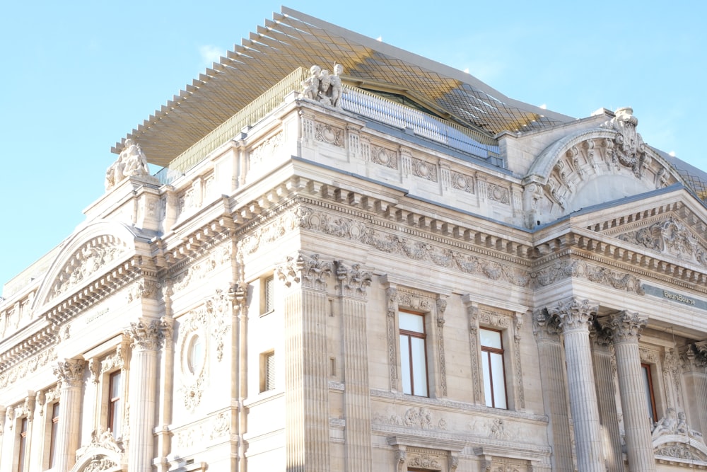 a large white building with a sky background