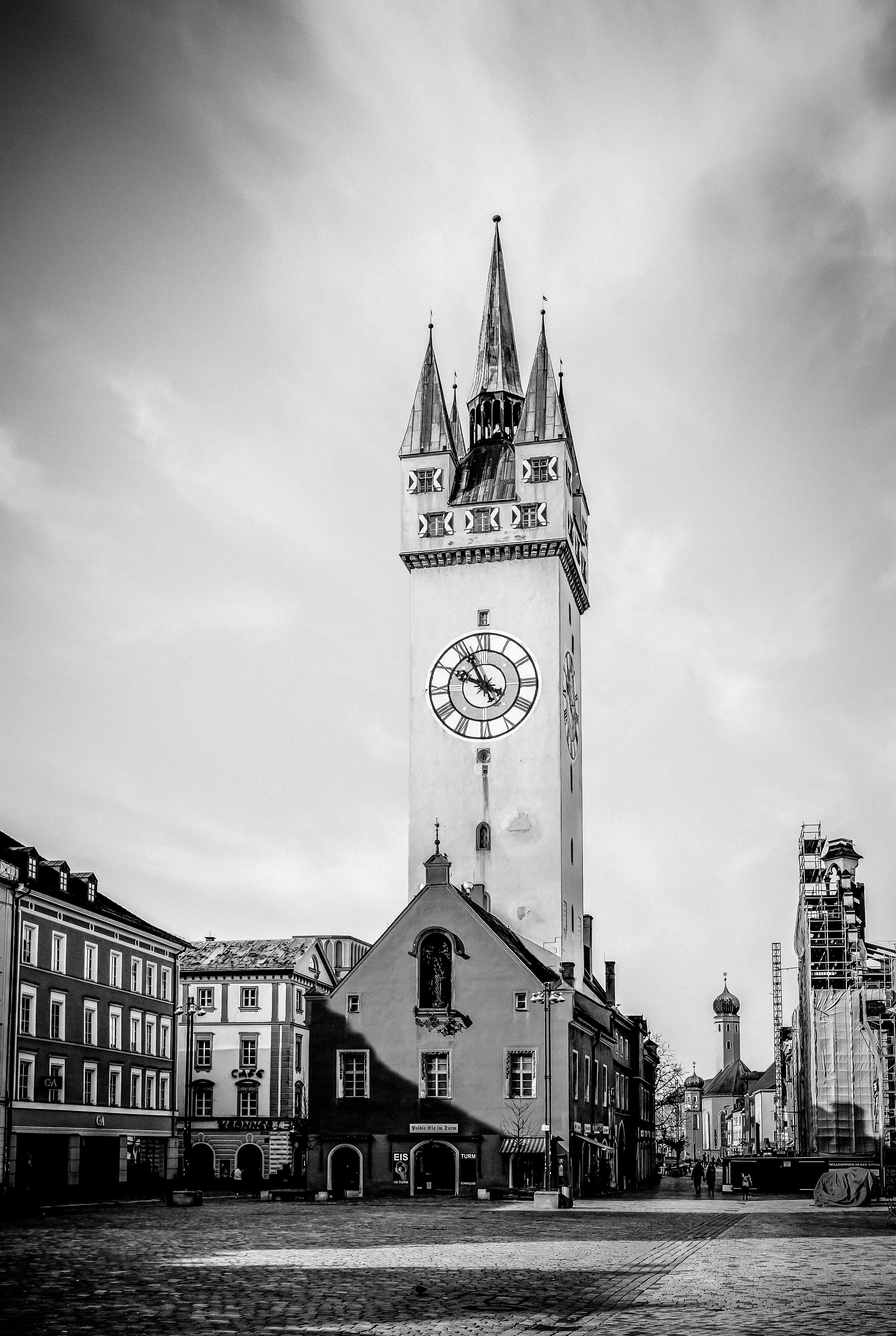 a black and white photo of a clock tower