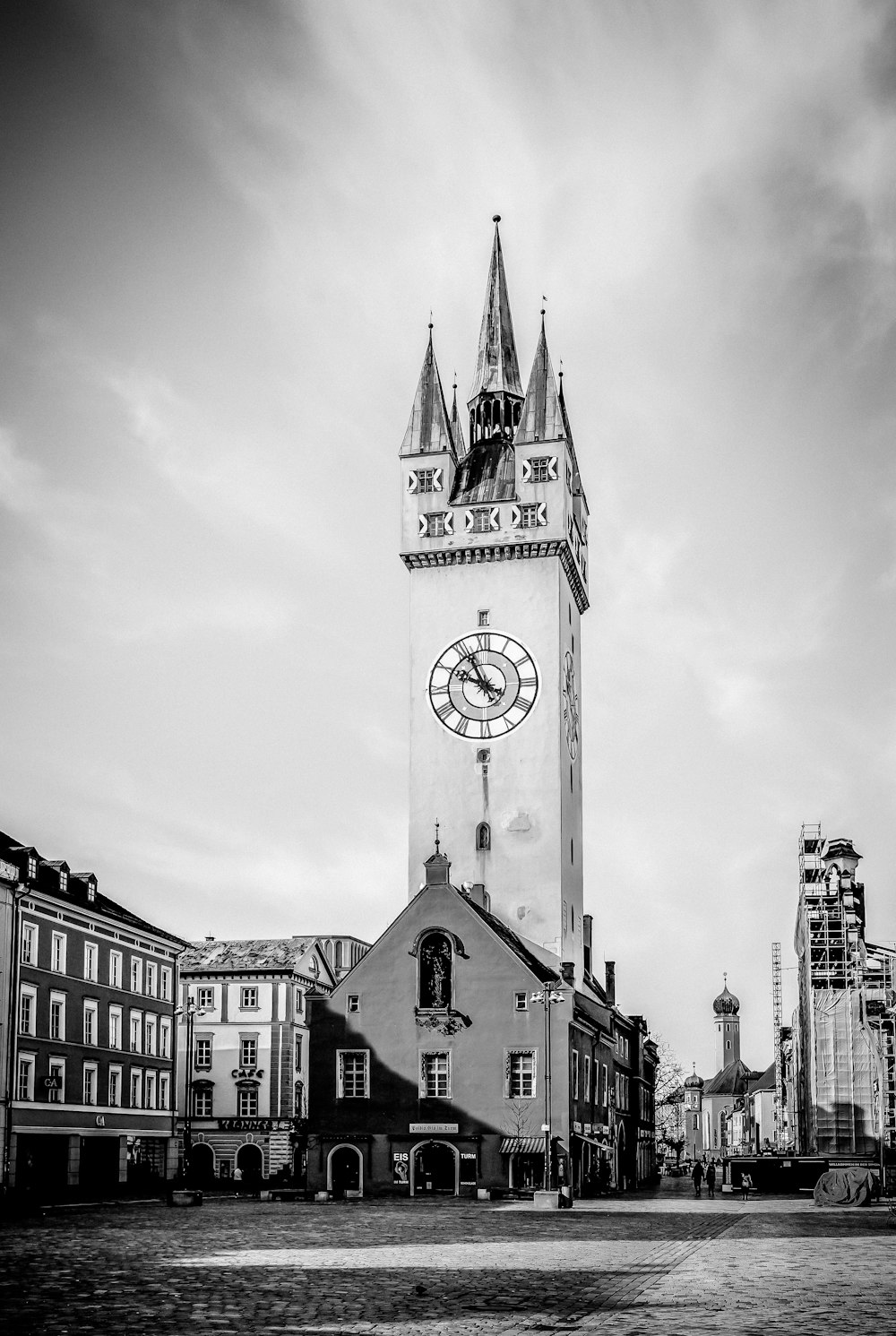 a black and white photo of a clock tower