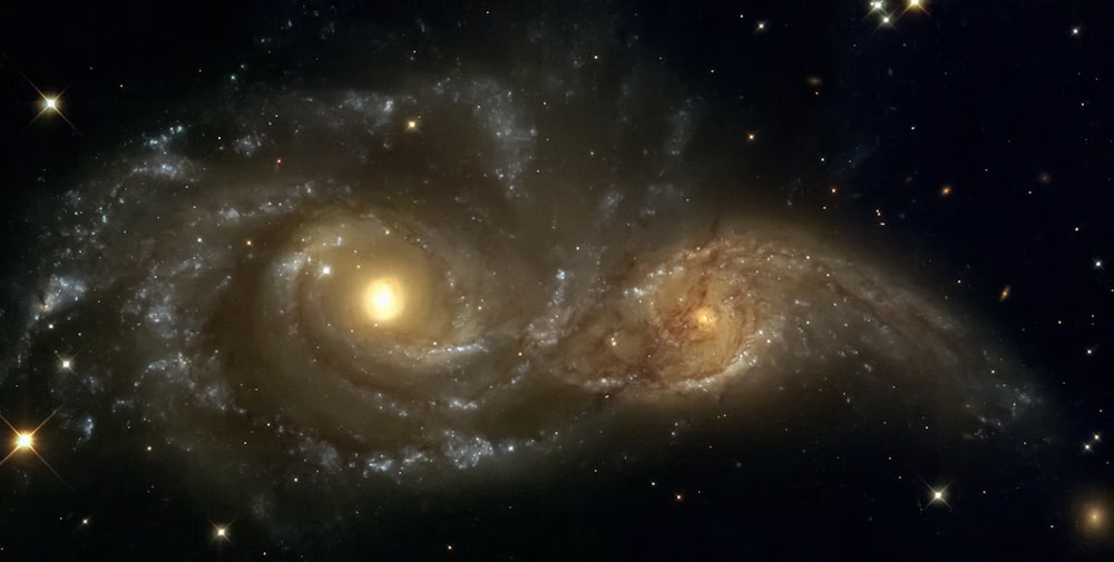 two spiral galaxy like objects in the sky