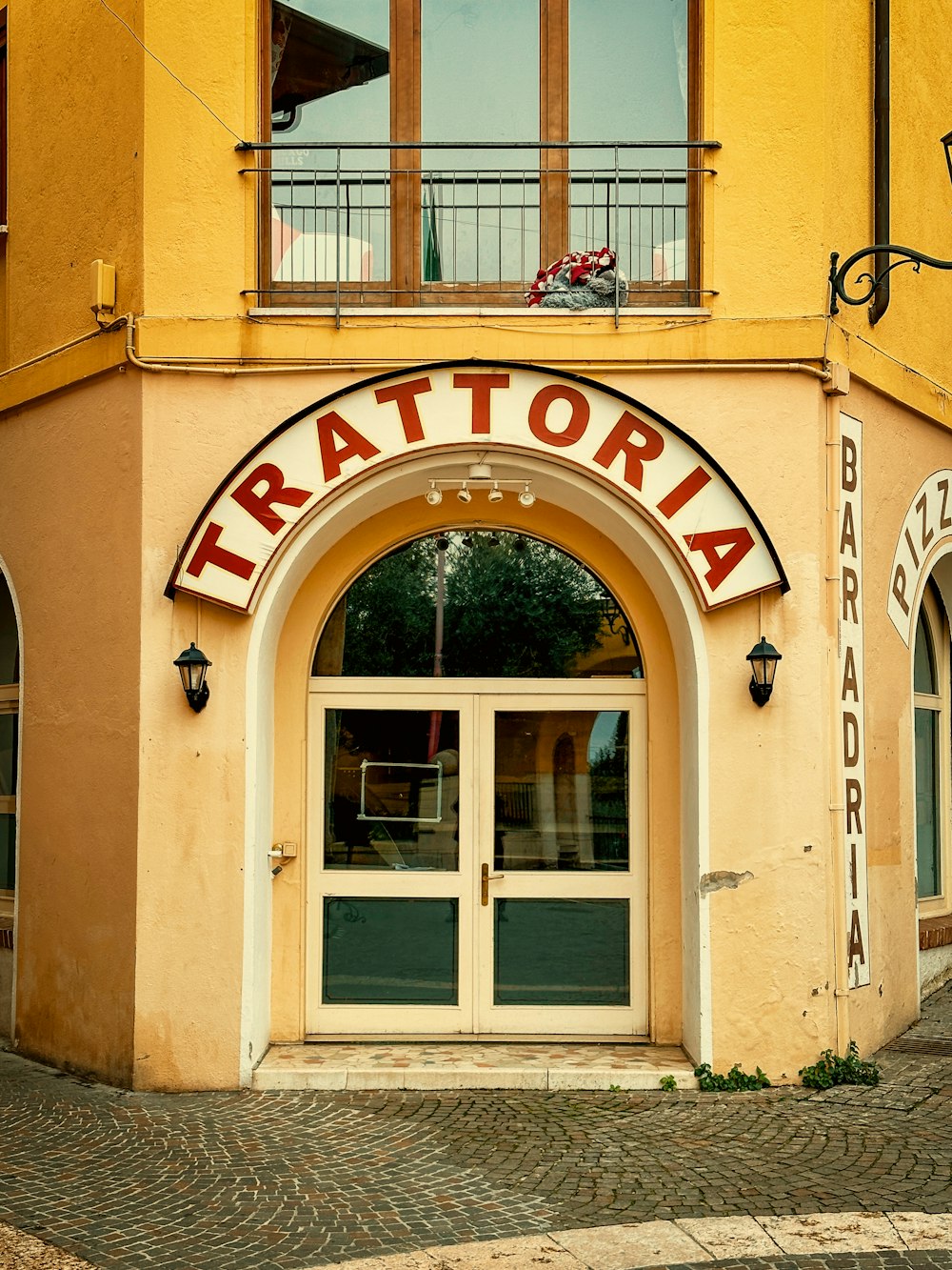 a yellow building with a sign that says tortoria