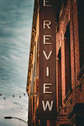 a brick building with a large sign on the side of it