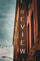 a brick building with a large sign on the side of it