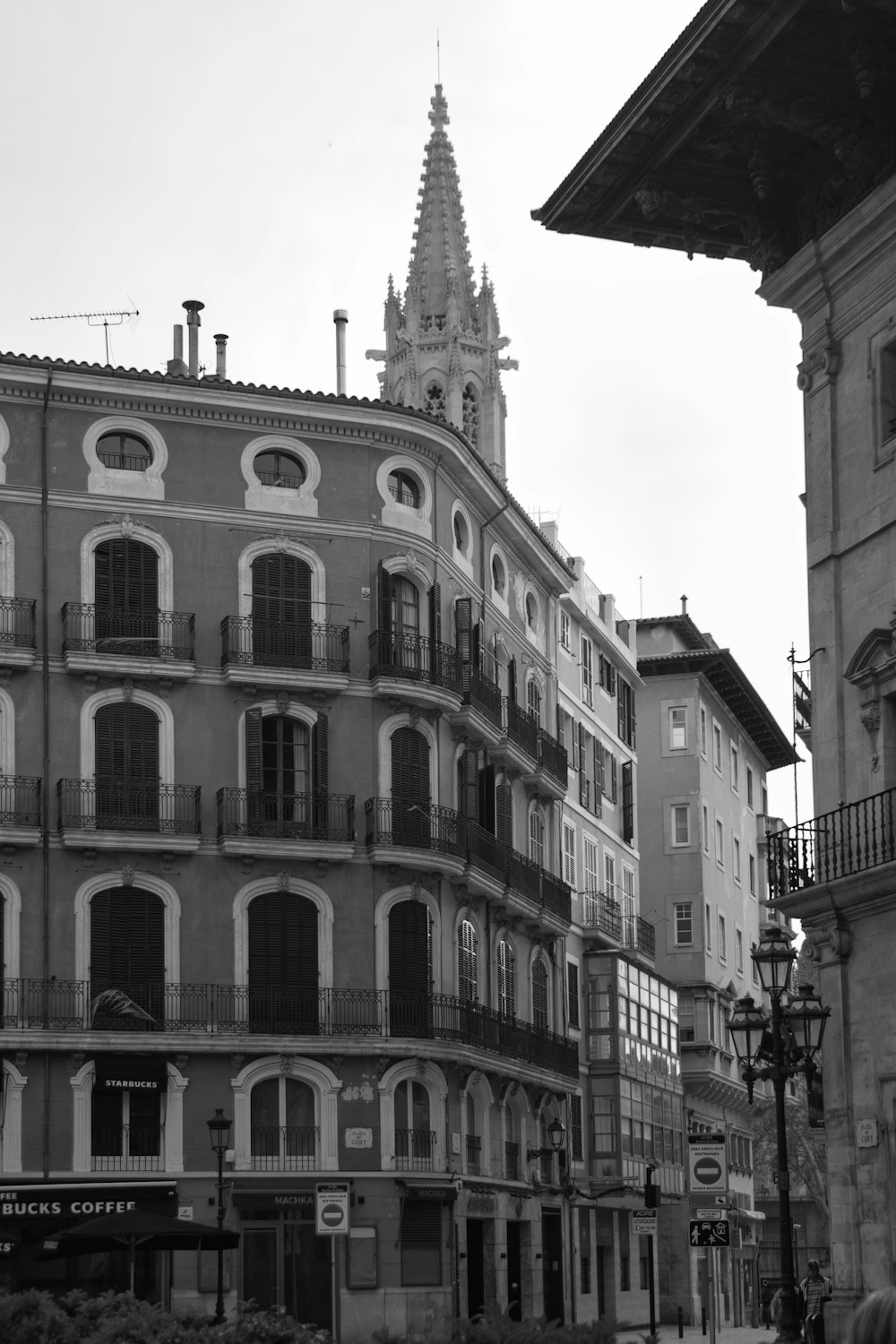 a black and white photo of a building with a clock tower