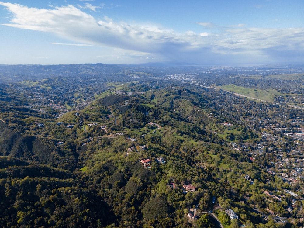 an aerial view of a lush green valley