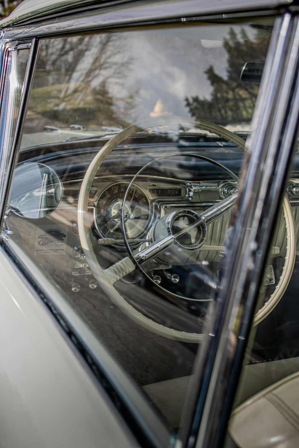 the interior of a car with a steering wheel and dashboard