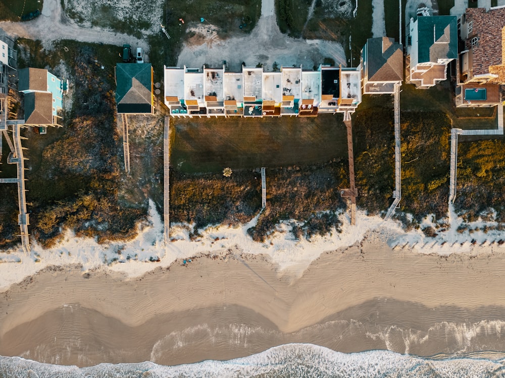 a bird's eye view of a beach and houses