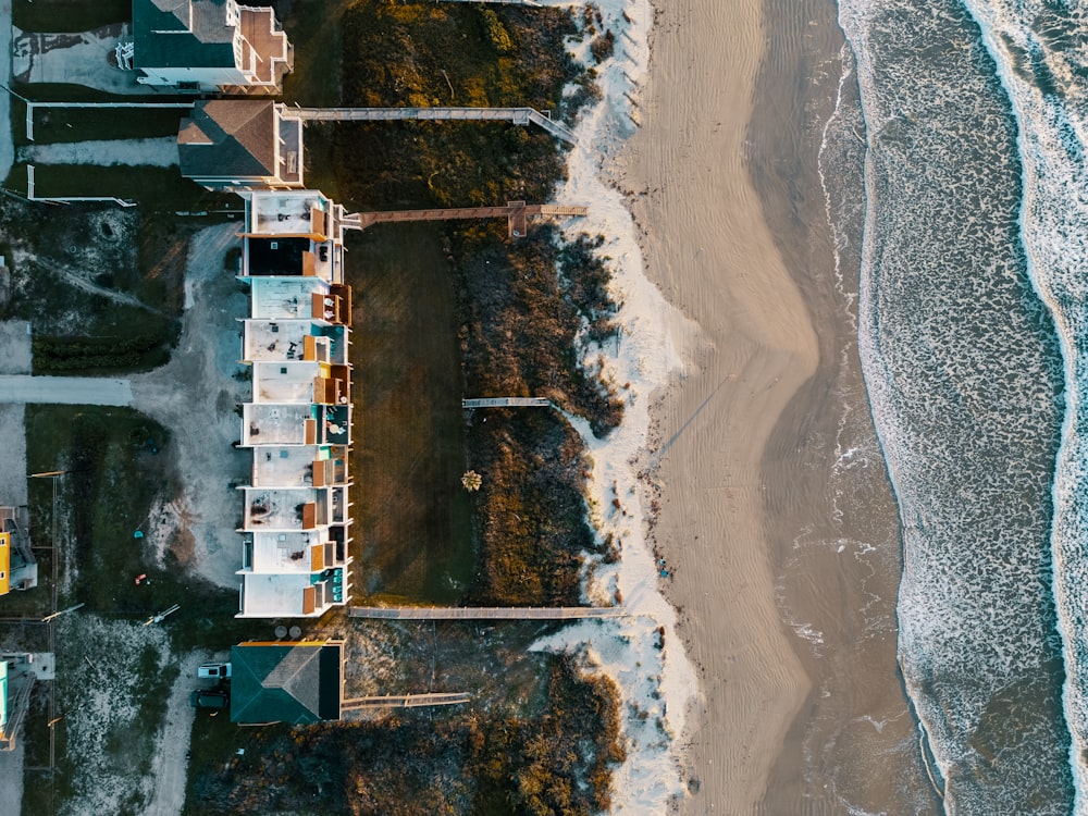 a bird's eye view of a beach and houses