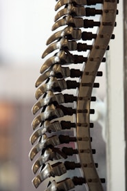 a bunch of metal objects hanging from a wall