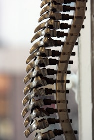 a bunch of metal objects hanging from a wall