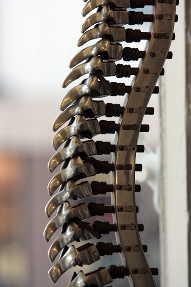 a bunch of metal objects hanging from a wall