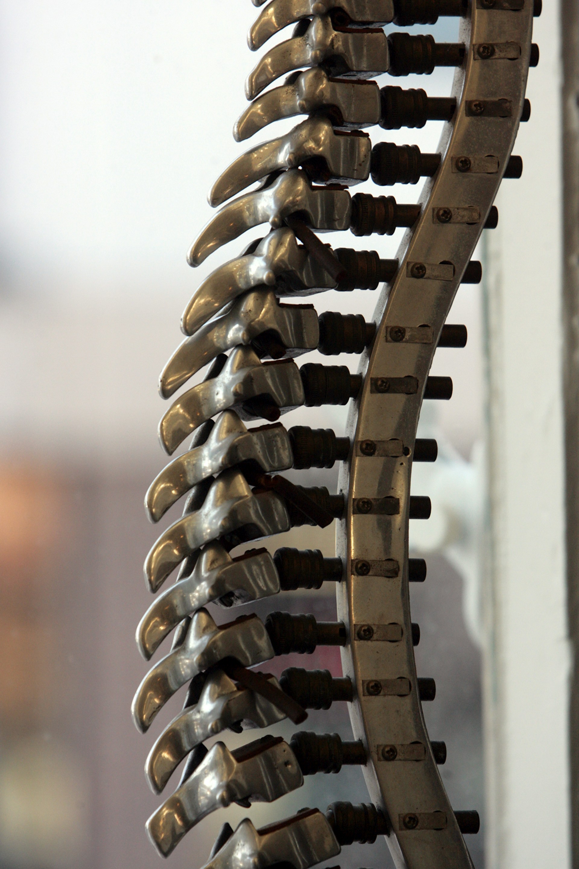a bunch of metal objects hanging from a wall