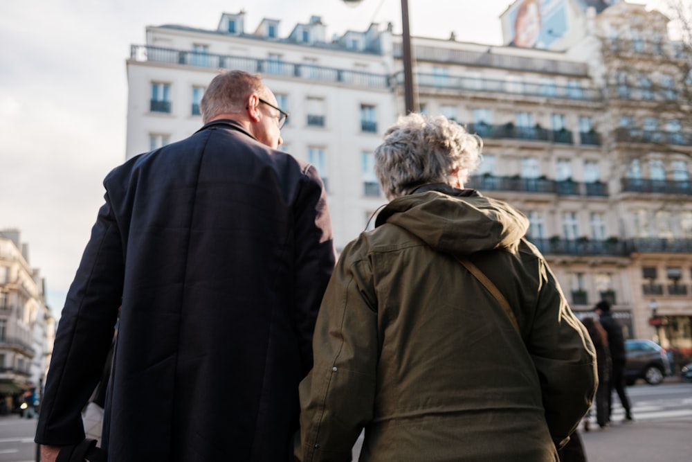 a man and a woman walking down a street