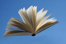 an open book flying in the air