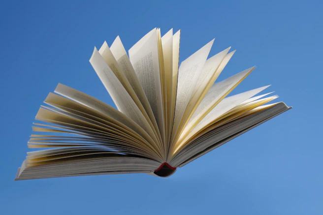 an open book flying in the air