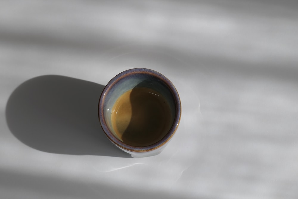 a coffee cup sitting on top of a table