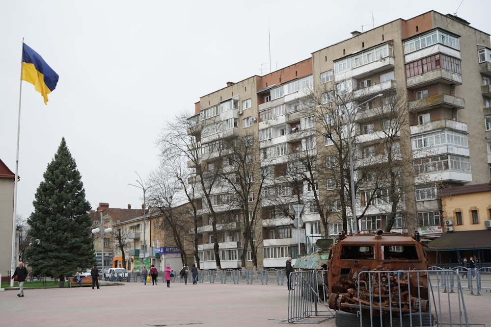 an old car is parked in front of a building