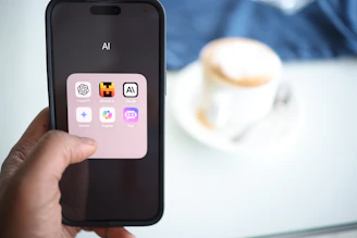 a person holding a cell phone in their hand