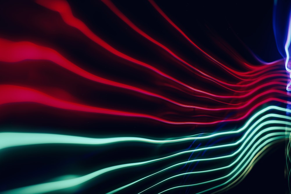 an abstract image of lines and colors in the dark