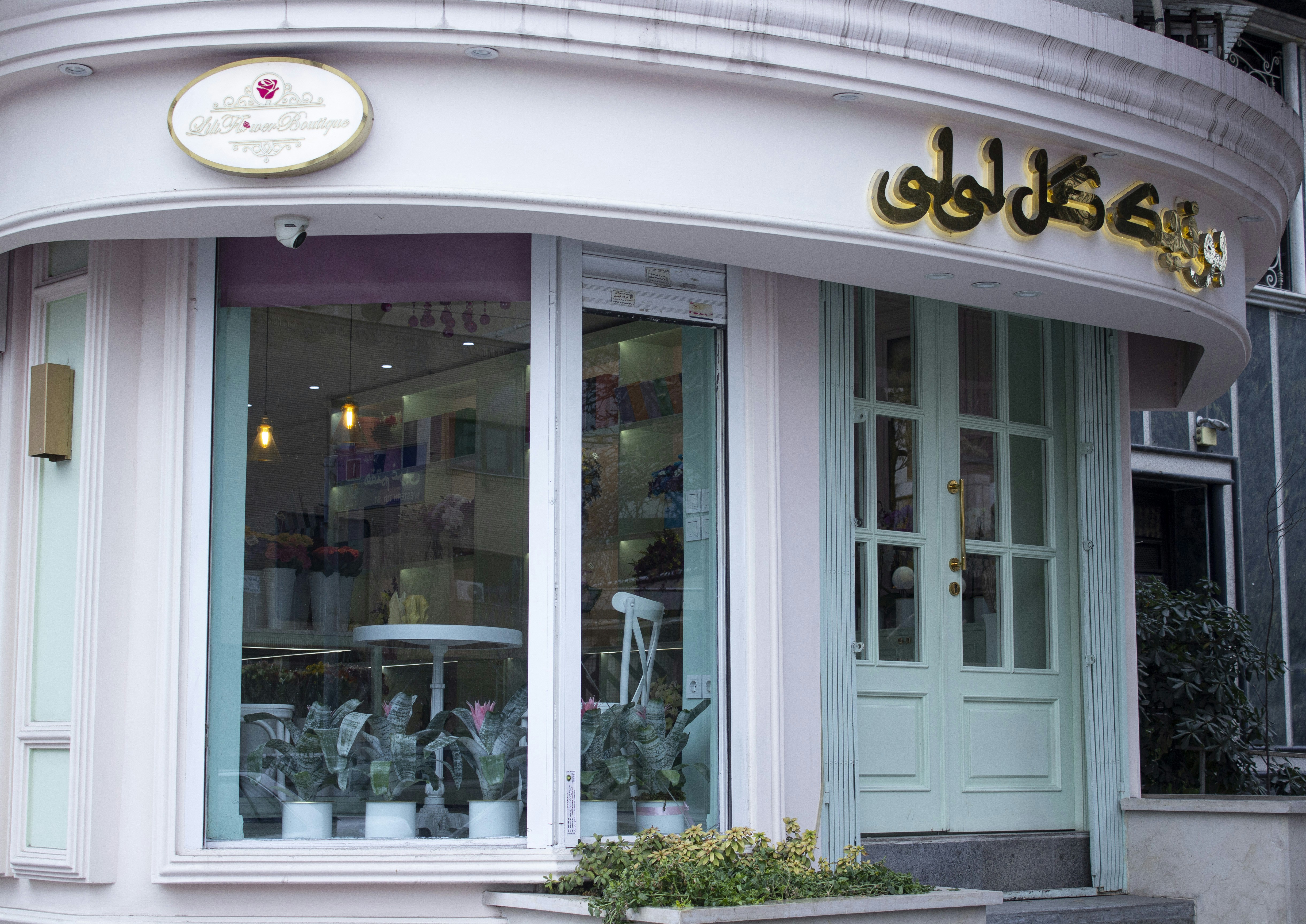a store front with a lot of vases in the window