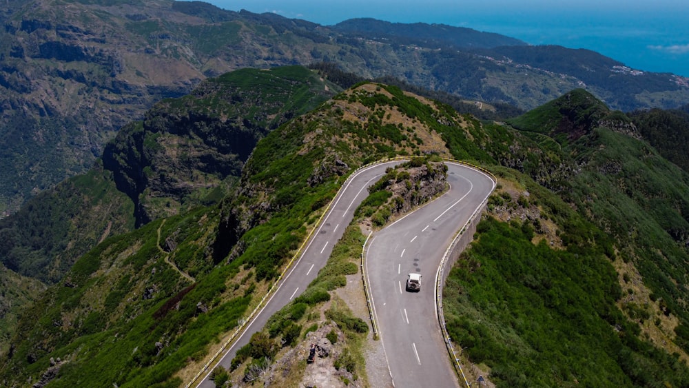 a car driving down a winding mountain road