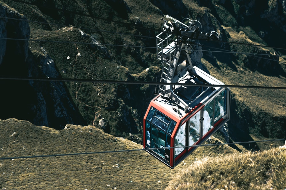 a cable car going up a mountain side