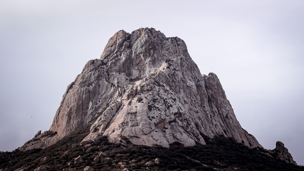 a very tall mountain with a sky background