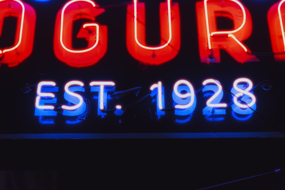 a neon sign that reads oguru est 1932
