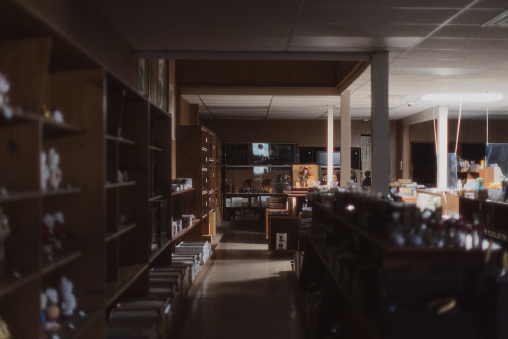 a room filled with lots of shelves filled with books