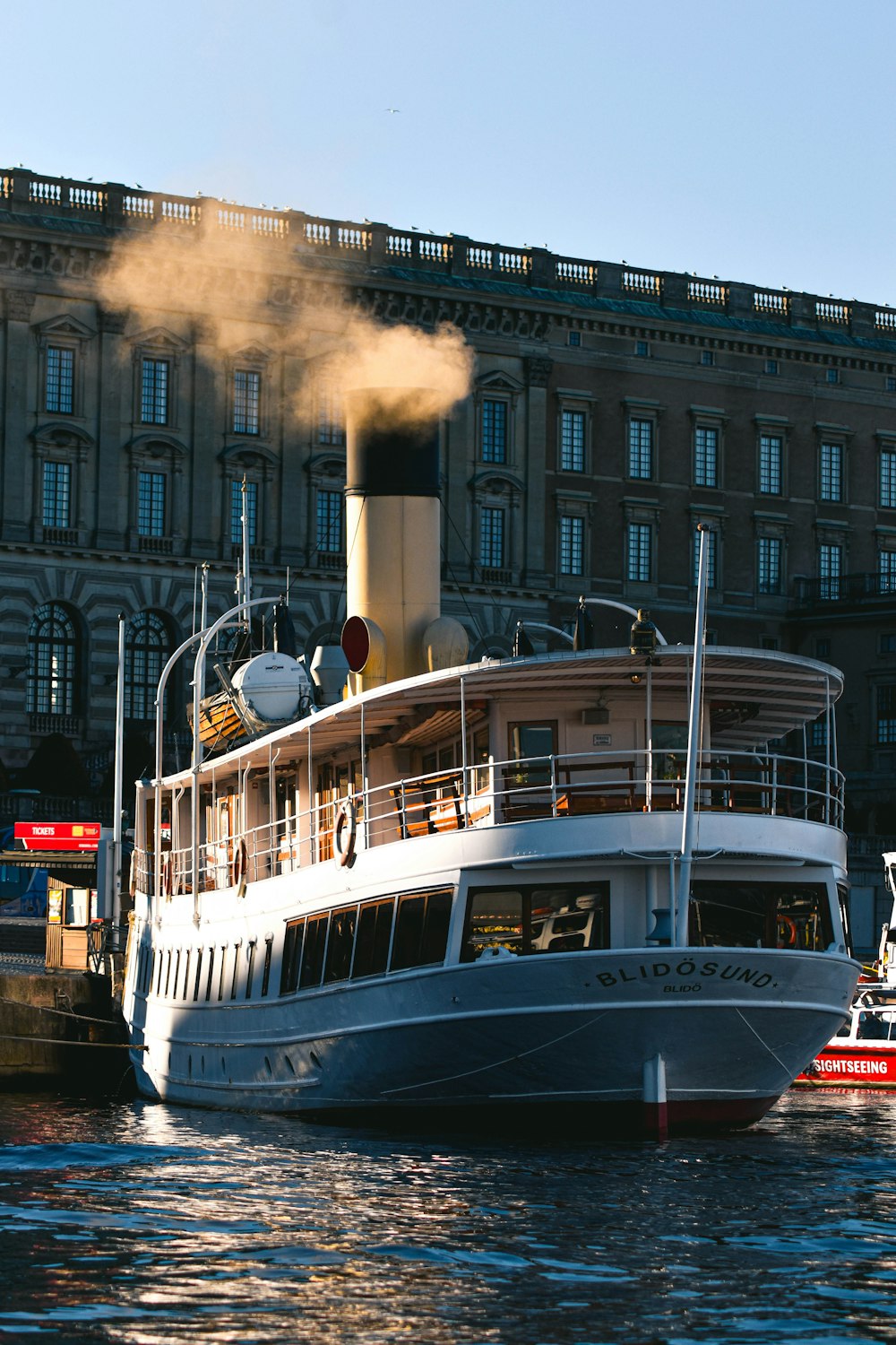 a large boat floating on top of a body of water