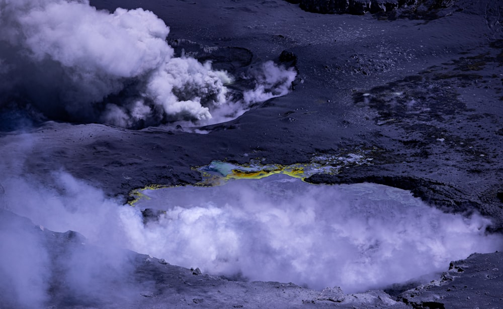 a crater with steam coming out of it