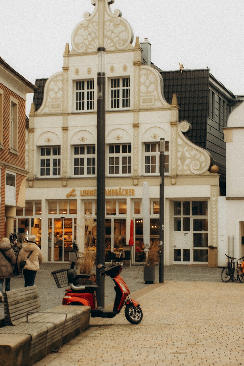 a scooter is parked in front of a building