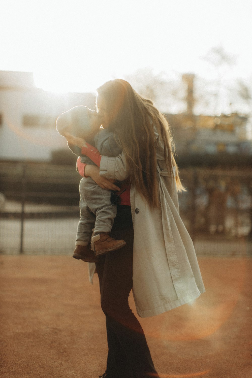 a woman holding a baby in her arms