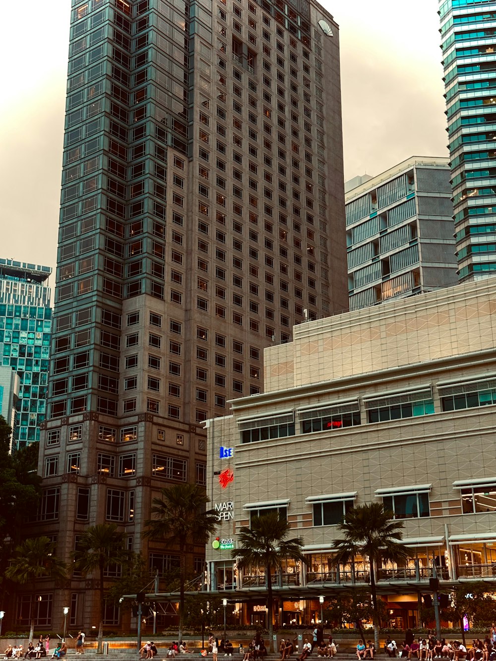 a large group of people walking around a city