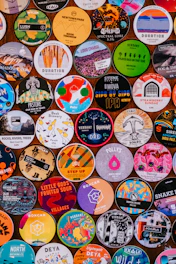 a wall full of different colored and black and white buttons