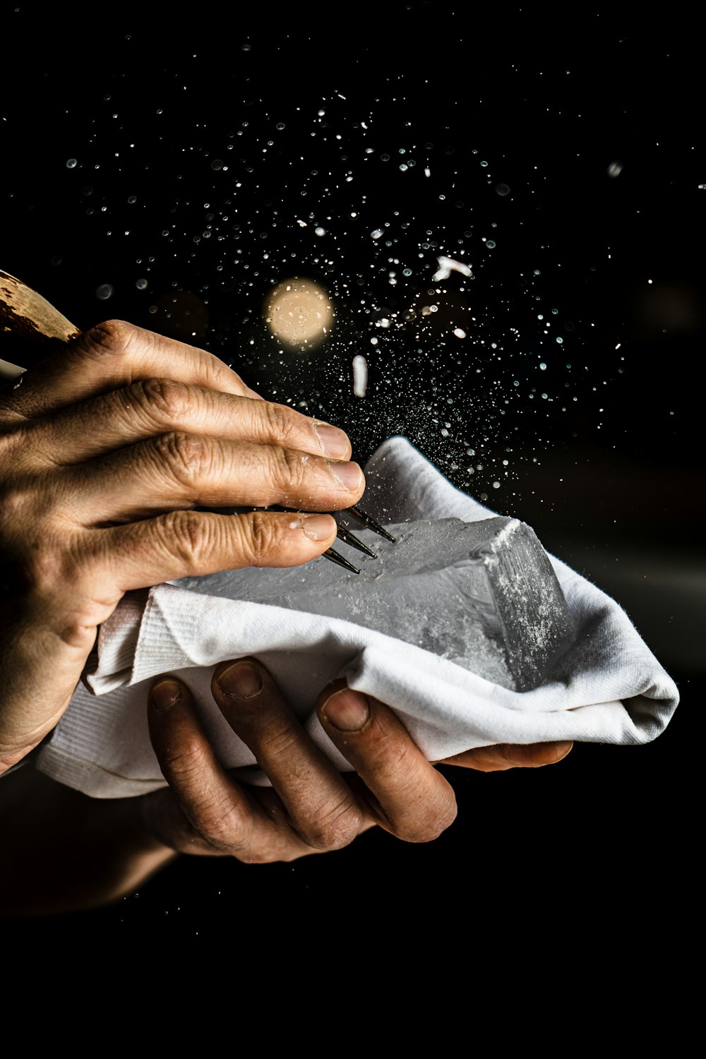 a person is holding a napkin with food flying out of it