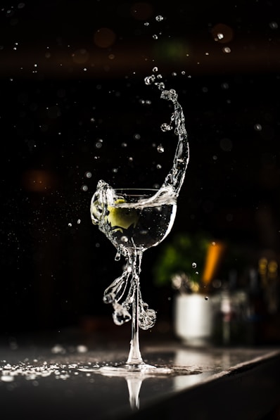 a glass of wine with a splash of water on it