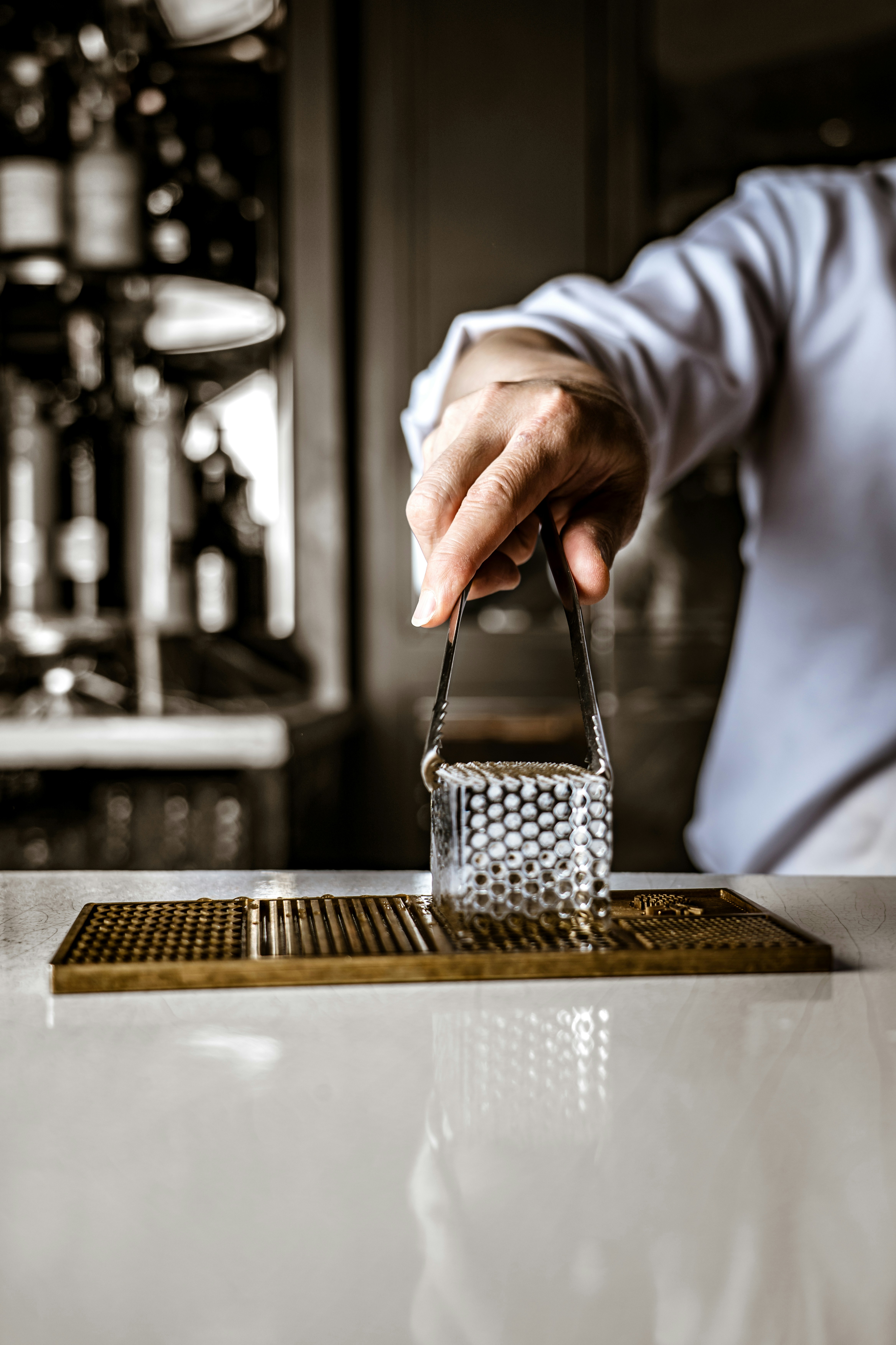 a person holding a glass in their hand
