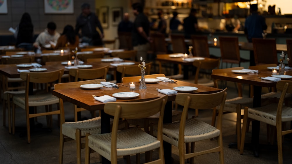 a group of people sitting at a table in a restaurant