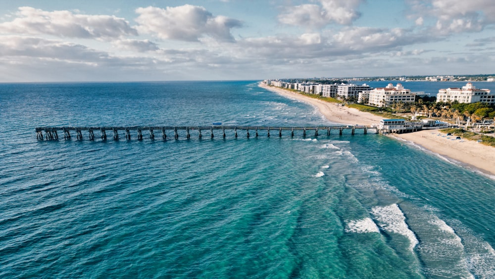 an aerial view of a beach and a pier