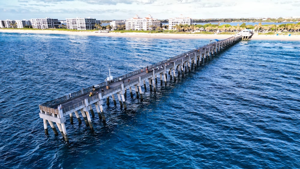 a long pier in the middle of a body of water