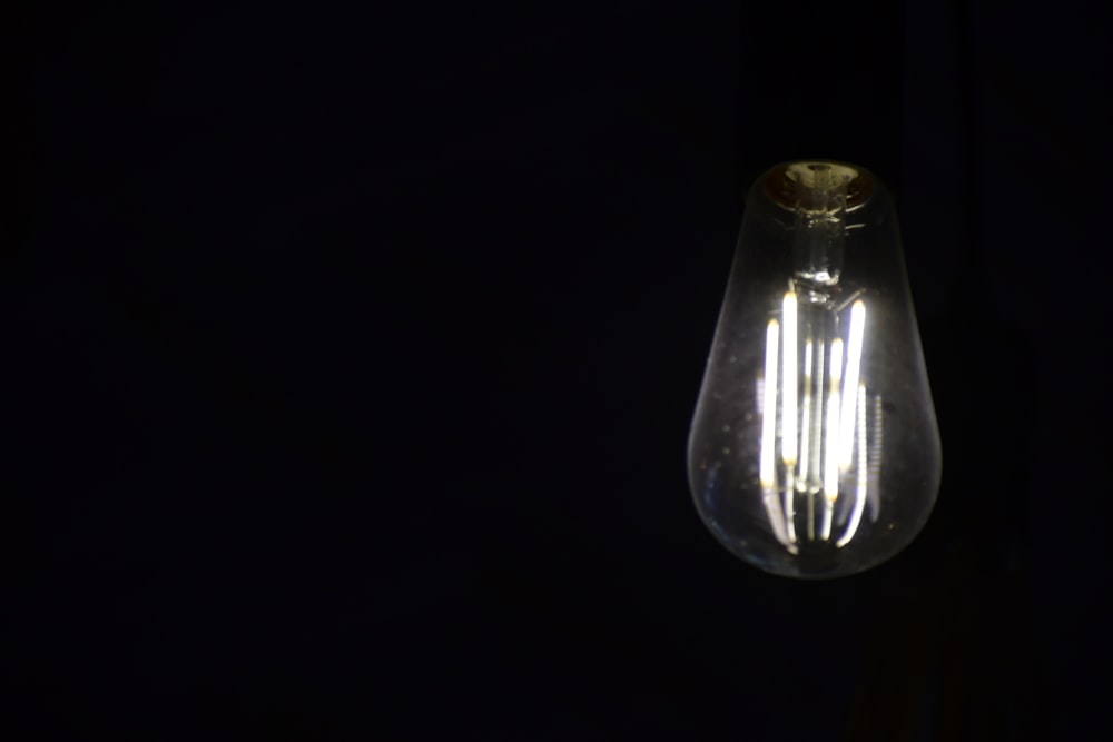 a light bulb that is lit up in the dark