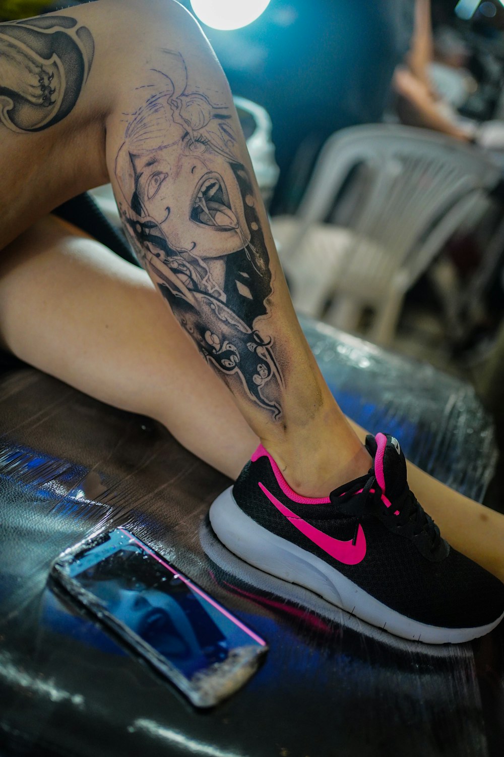 a person with a tattoo on their leg