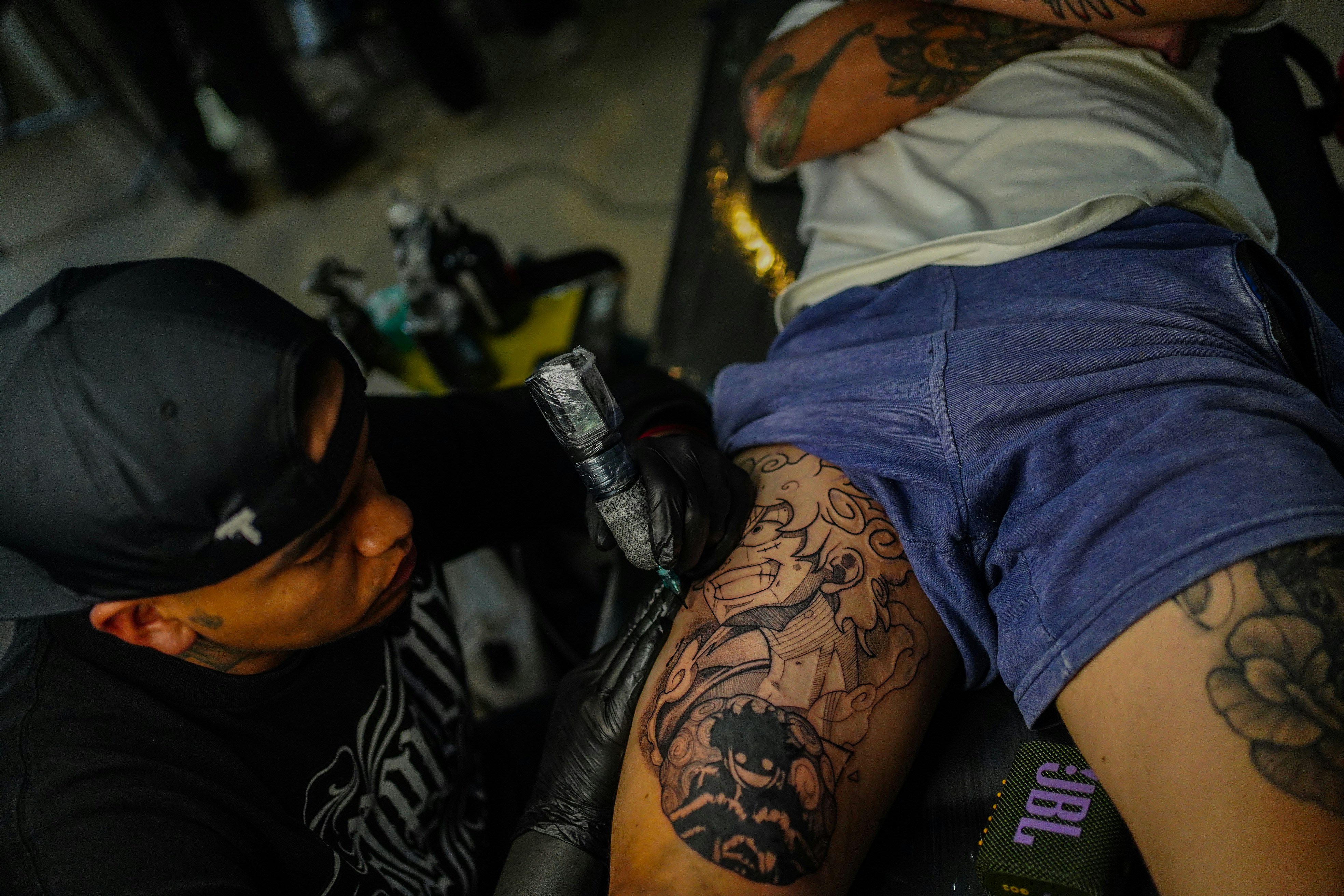 a man with a tattoo on his leg