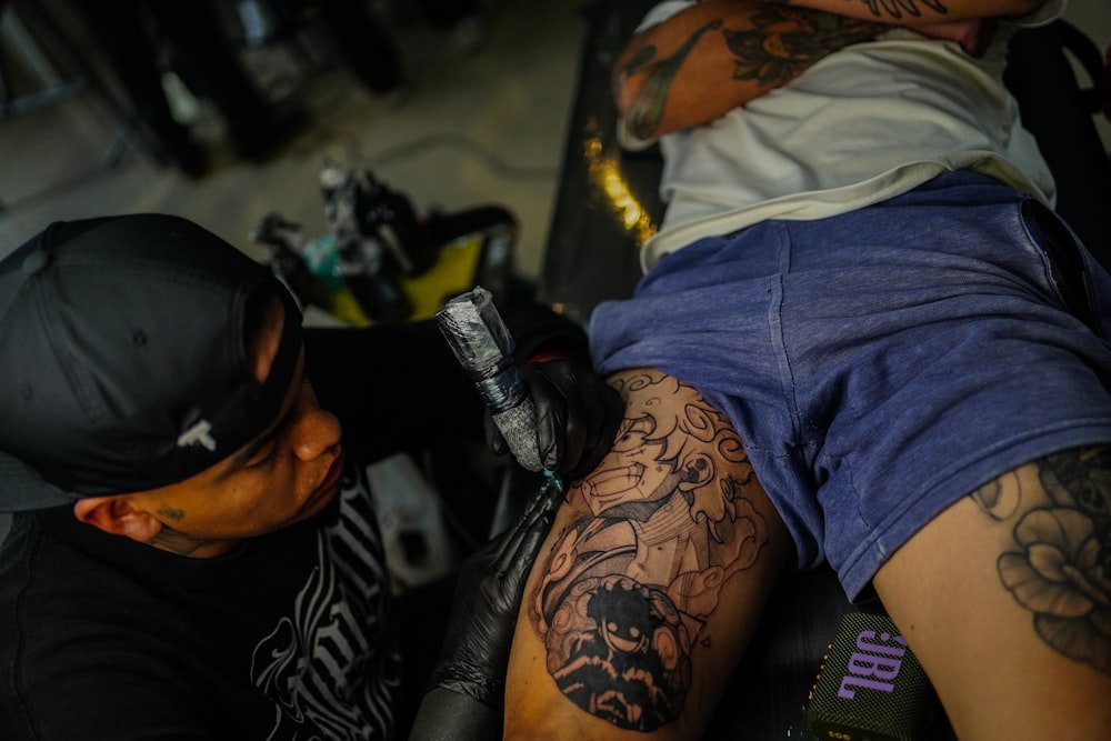 a man with a tattoo on his leg