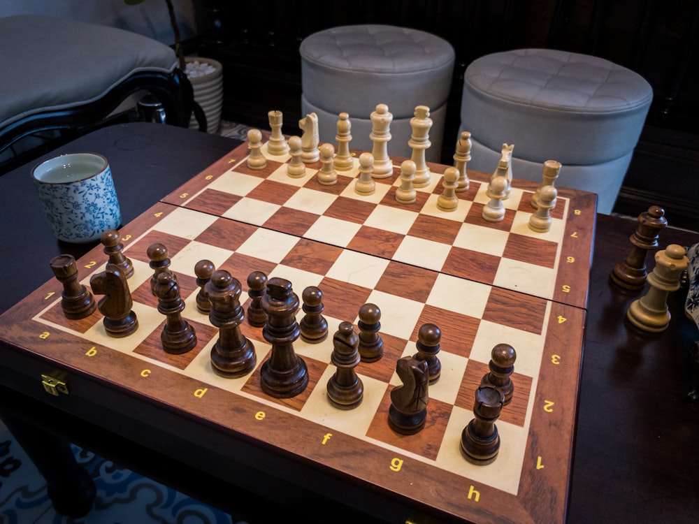 a wooden chess board with chess pieces on it