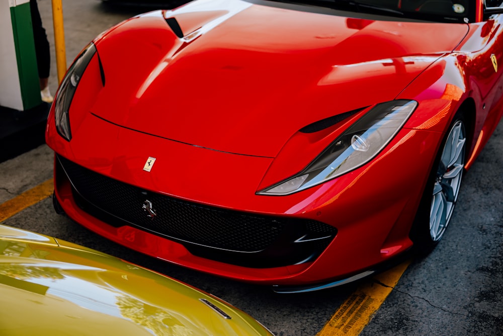 a red sports car parked in a parking lot