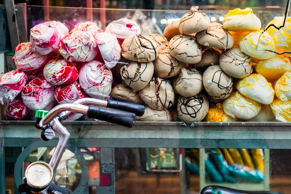 a bicycle parked next to a pile of mushrooms