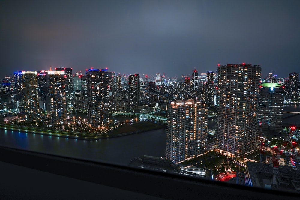 a view of a city at night from the top of a building