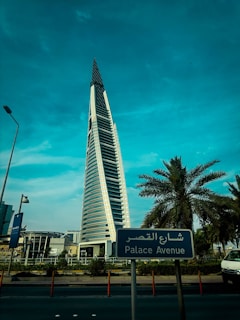a very tall building with a sign in front of it